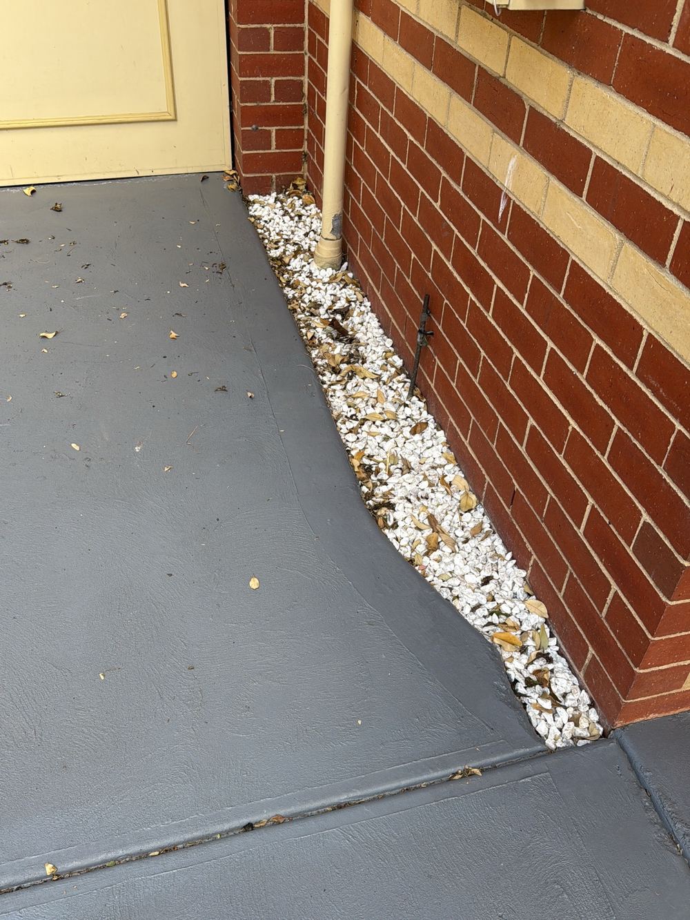 Poor surface drainage holding moisture against the house, found during a building and pest inspection in Newport