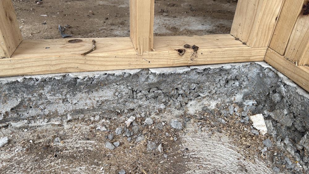Honeycombing along the slab edge, which can weaken the concrete and let water in, found during a frame inspection in Mambourin