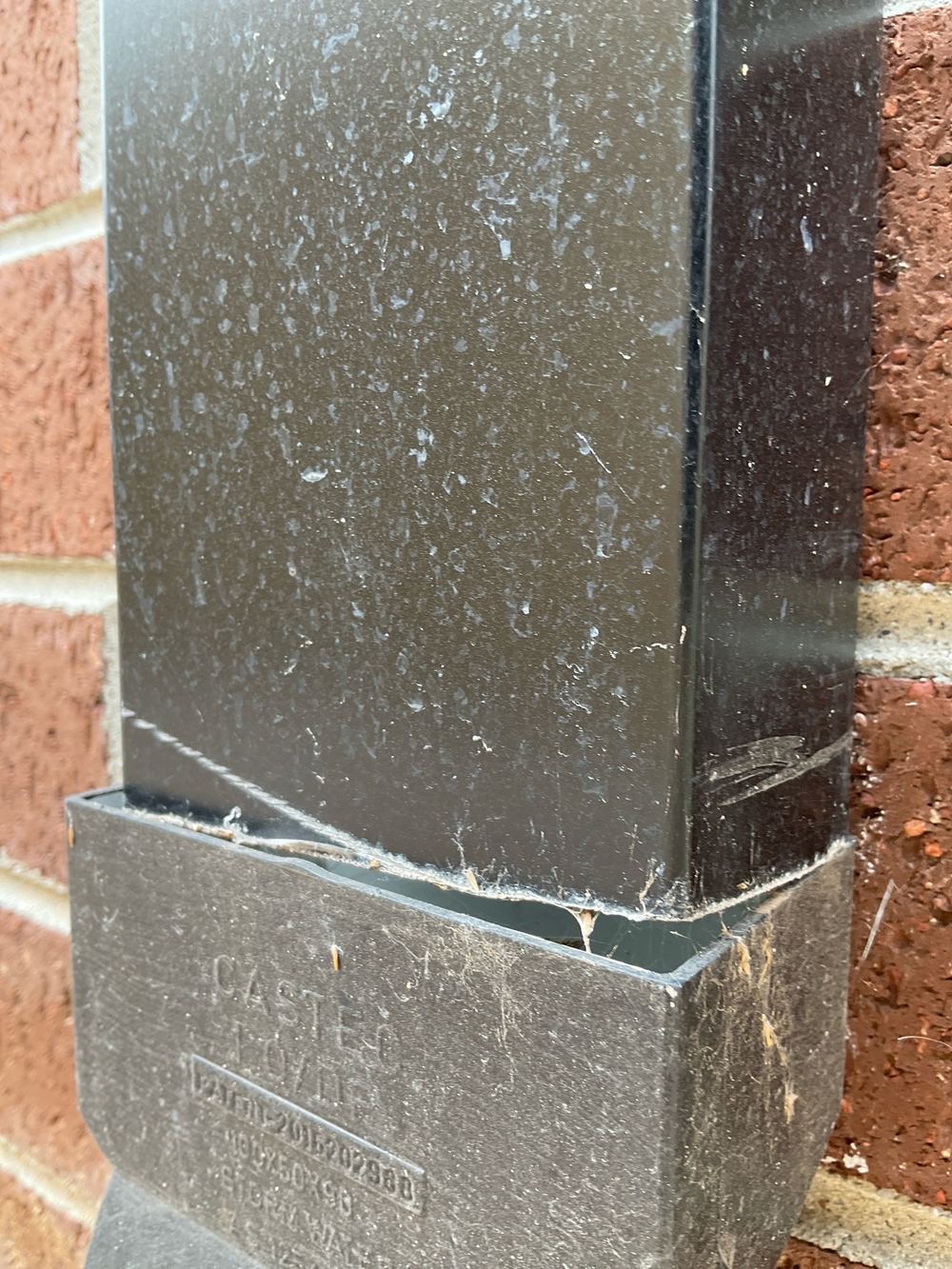 Downpipe disconnected from the stormwater line, dumping water beside the house, found during a pre-handover inspection in Mambourin