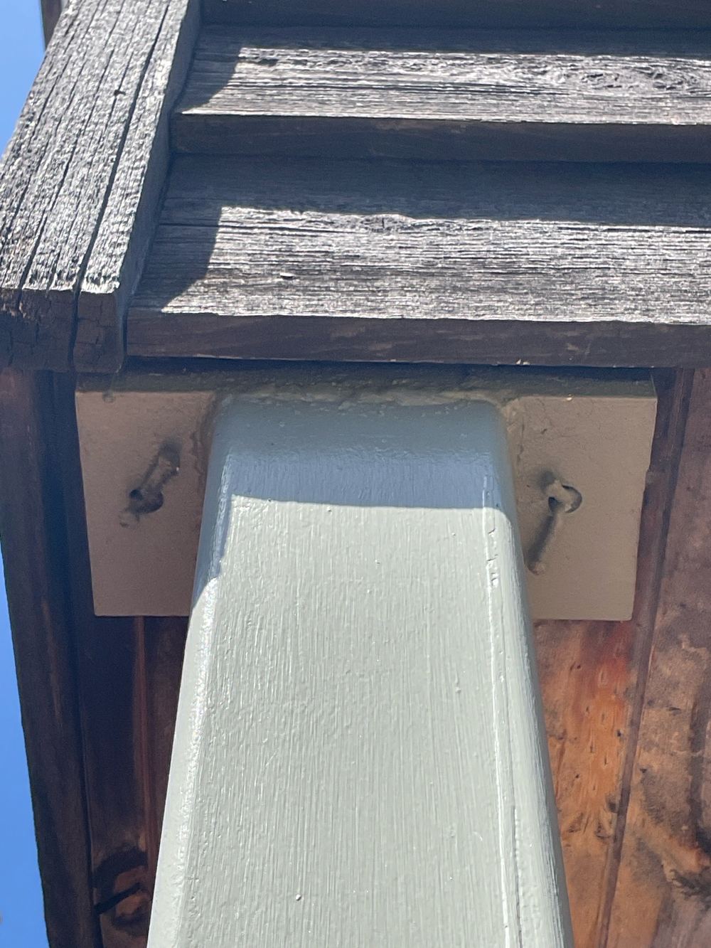 Weak connection where a steel post meets the floor above, found during a pre-purchase inspection in Newport